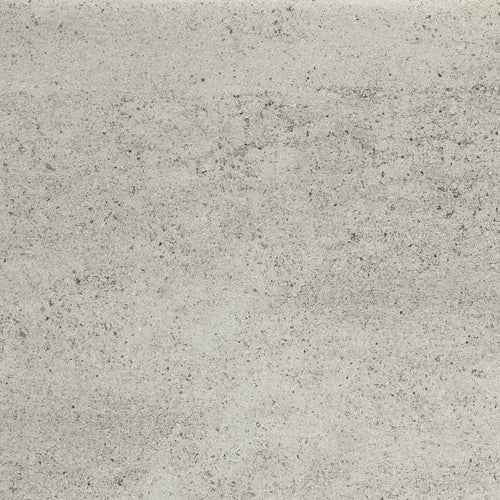Close-up of Dekton Keon stone showcasing a cool, light grey surface with subtle speckling and a concrete-inspired texture, perfect for contemporary Scandinavian interiors and tabletops.