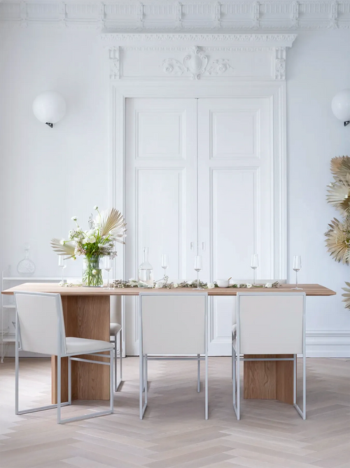 Ann Dining Table in solid oak set for dinner in a white period dining room with ornate stucco and herringbone floors
