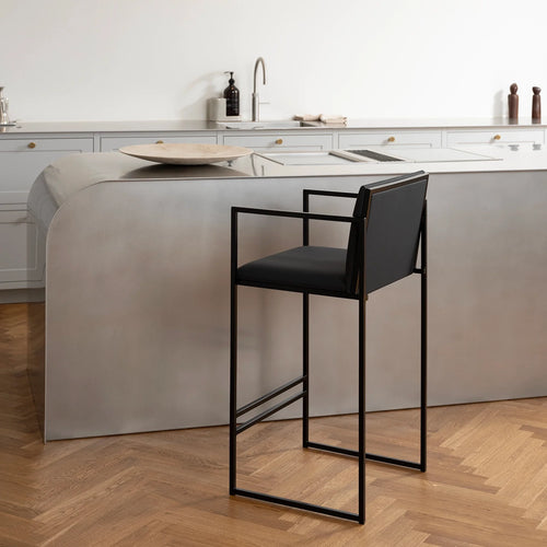 Bruno bar stool in jade black leather with a sleek black frame, ideal for modern kitchen bars and high-top counters.