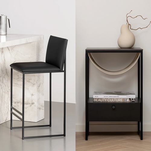 Minimalist black bar stool with vegan leather seat paired with a black bedside table featuring a suspended magazine holder and matte ceramic decor—styled for Scandinavian interiors, ideal for care advice visual.