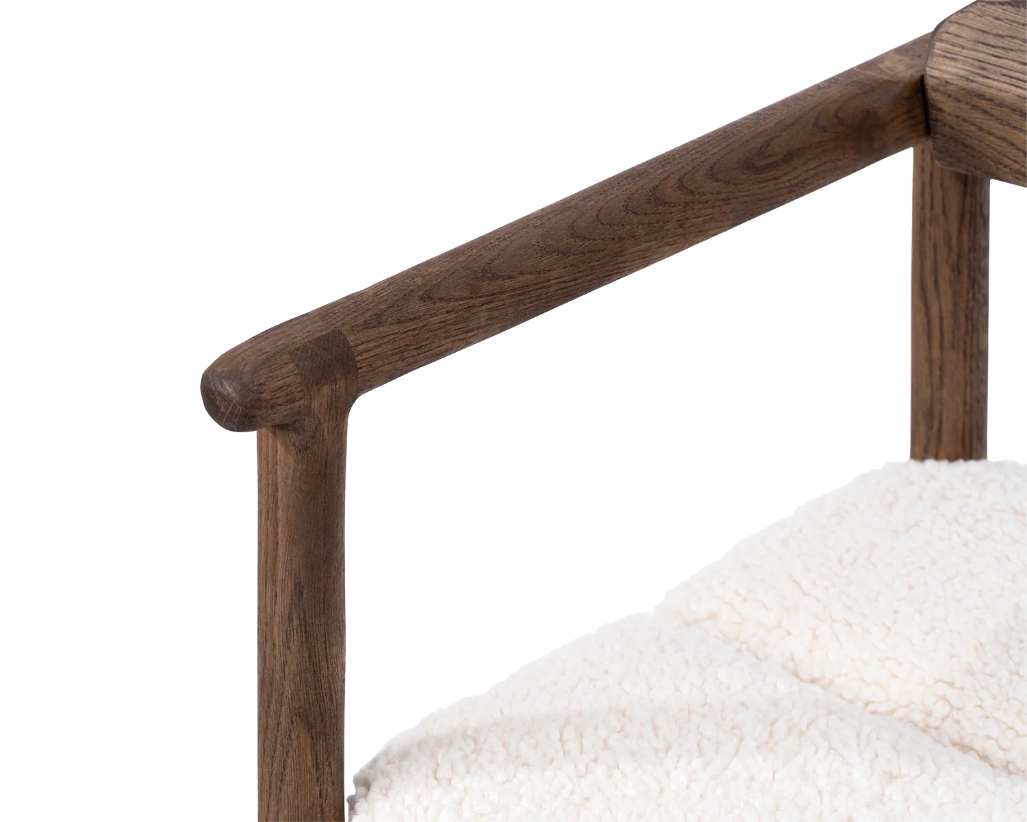 Close-up of Carl Bar Stool armrest in dark oak, showcasing smooth craftsmanship and natural wood grain | by Crea.