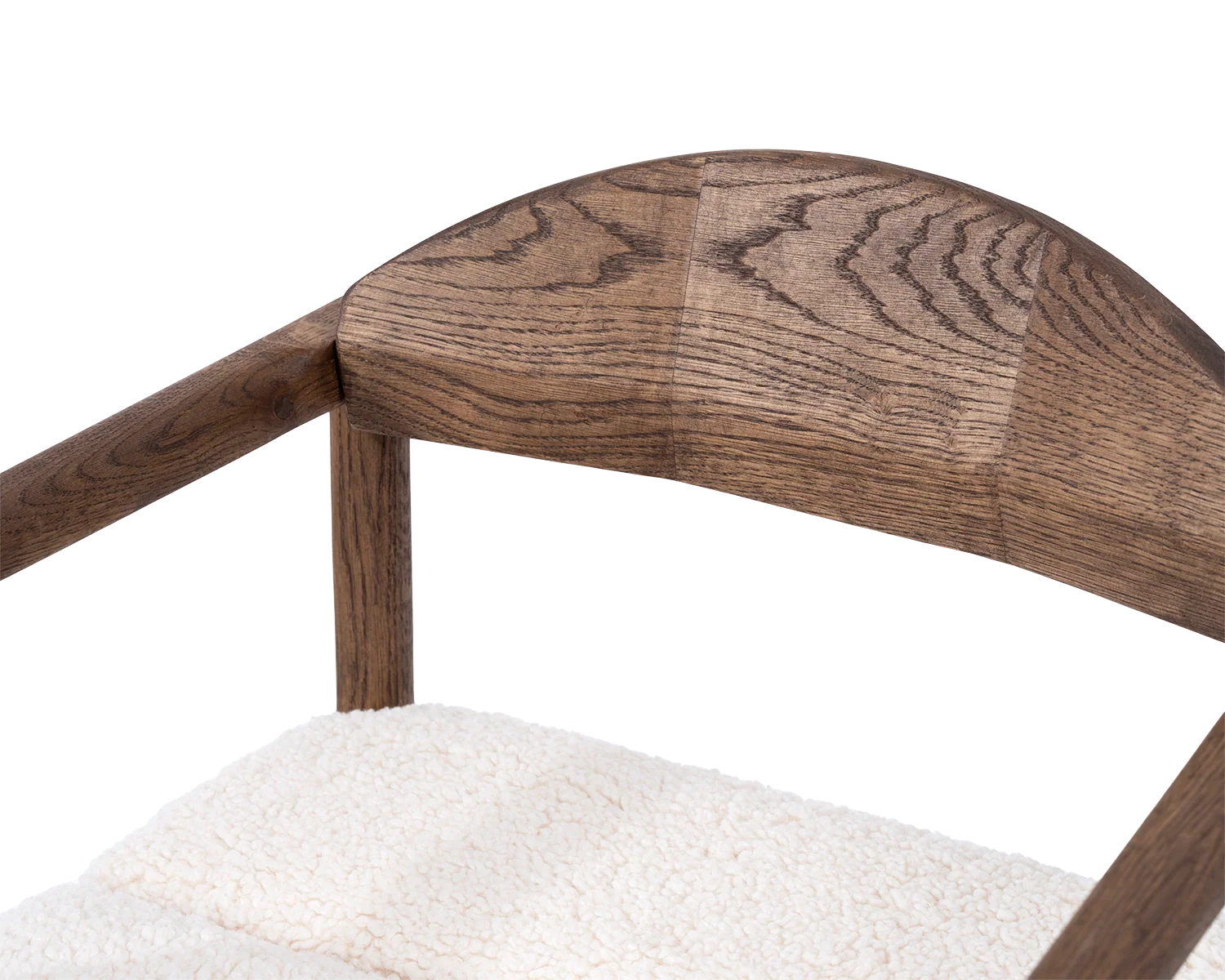 Close-up of Carl Bar Stool backrest in dark oak showing the curved solid wood joinery and grain detail above ivory bouclé seat | by Crea.