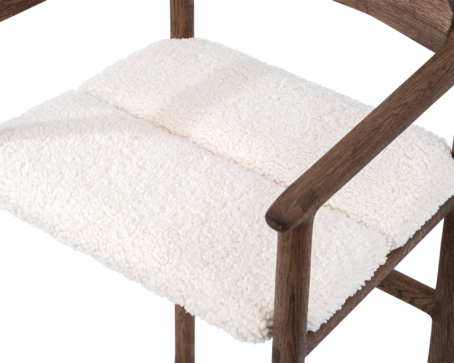 Close-up of Carl Bar Stool seat in ivory bouclé fabric with dark oak frame and armrest detail | by Crea.