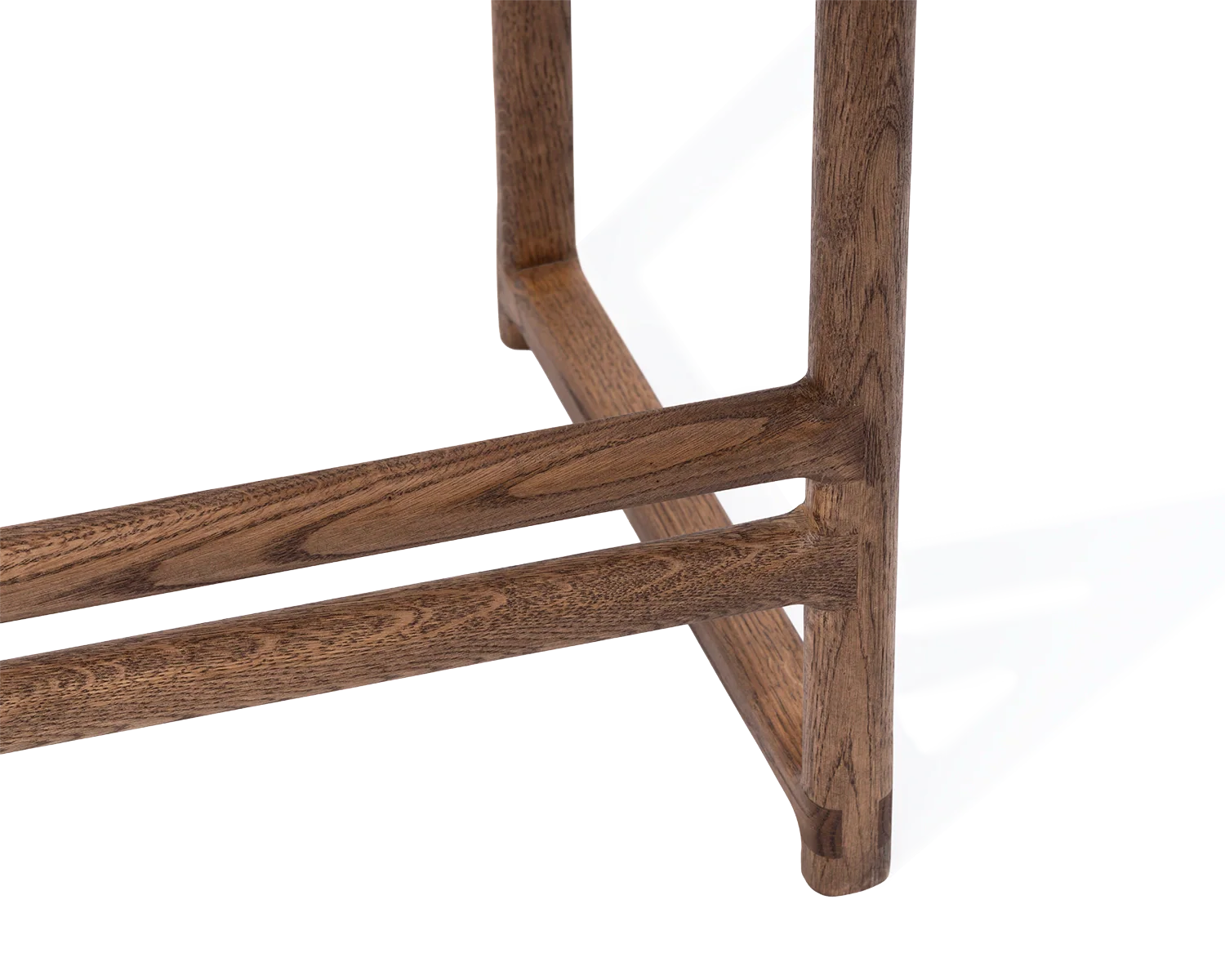 Close-up of Carl Bar Stool footrest and leg detail in solid dark oak | by Crea