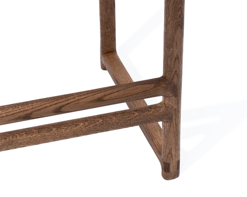 Close-up of Carl Bar Stool footrest and leg detail in solid dark oak | by Crea