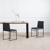 Diana dining table in black with oak featuring two stylish black chairs, perfect for a Scandinavian-inspired dining setup.