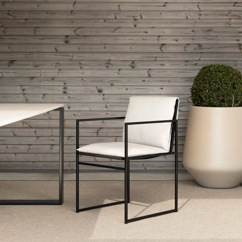 Elsy outdoor chair in black frame with marble acrylic, enhancing contemporary outdoor spaces with sleek design.