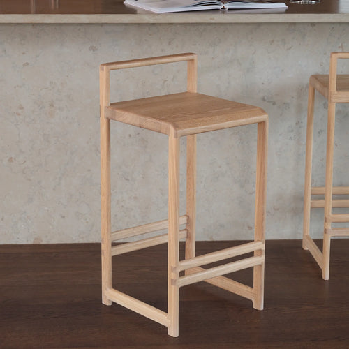 Ebba bar stool in oak, a sleek and modern design perfect for kitchens and dining spaces.