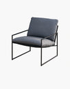 Stylish grey lounge chair with a sleek black frame, perfect for modern interior decor.