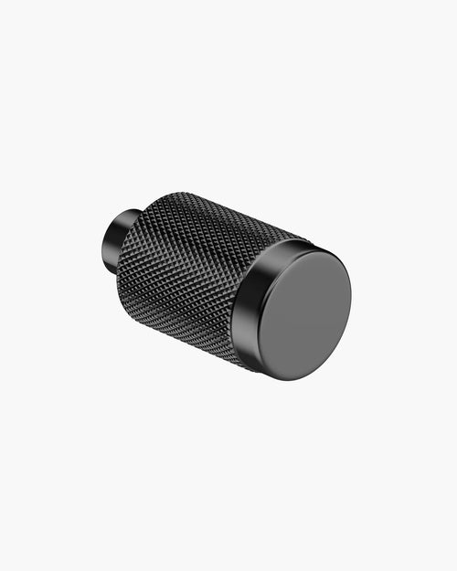 Minimalist black furniture knob designed for modern living, featuring a textured grip and sleek profile.