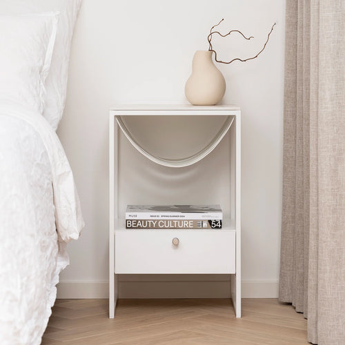 Iris bed table in white with Entzo dekton top, featuring a modern design, drawer, and decorative accents.