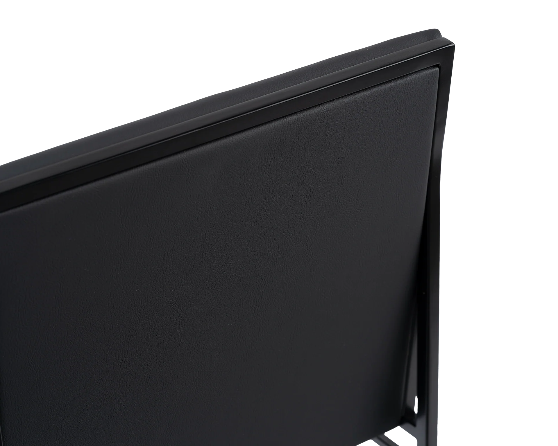 Angled close-up of the Isabell Dining Chair from by Crea, highlighting the smooth black vegan leather backrest framed by a minimalist black steel structure, showcasing Scandinavian craftsmanship.