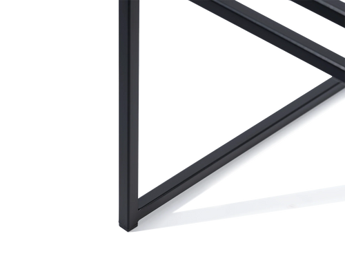 Close-up of the Isabell Dining Chair’s black steel leg with integrated plastic glider, designed by by Crea to protect flooring and enhance stability in minimalist Scandinavian interiors.