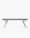 Melker dining table in sleek black oak design, featuring bold lines and a minimalist aesthetic for modern dining spaces.