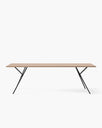 Melker dining table with a sleek wooden top and stylish black metal legs, perfect for elegant dining moments.