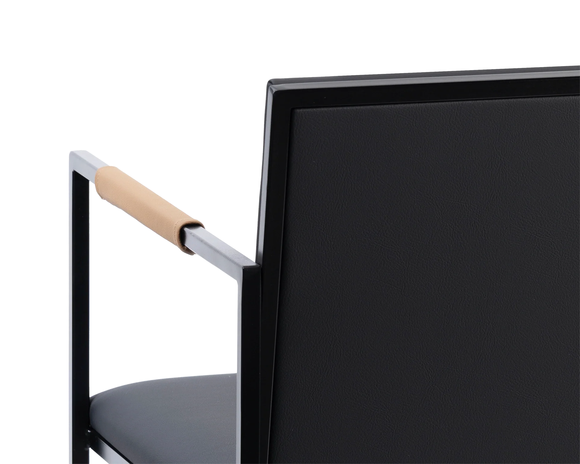 Detail of the Sella Dining Chair backrest in vegan leather with black powder-coated steel frame and tan leather-wrapped armrest, Scandinavian minimalist design.