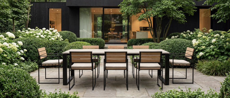 Outdoor dining set with chairs and table in a garden setting