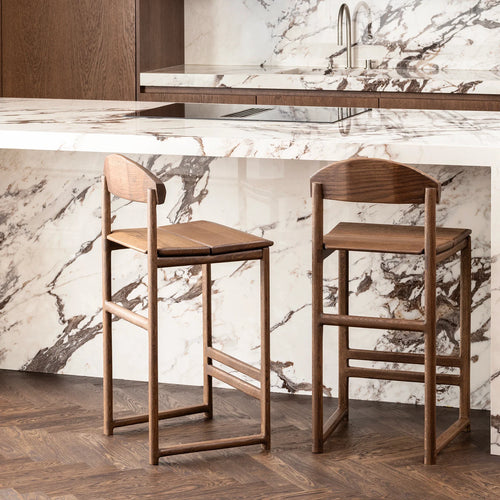 Ted bar stool in dark oak with wooden backrest, featuring a modern Nordic design, perfect for stylish bar setups.