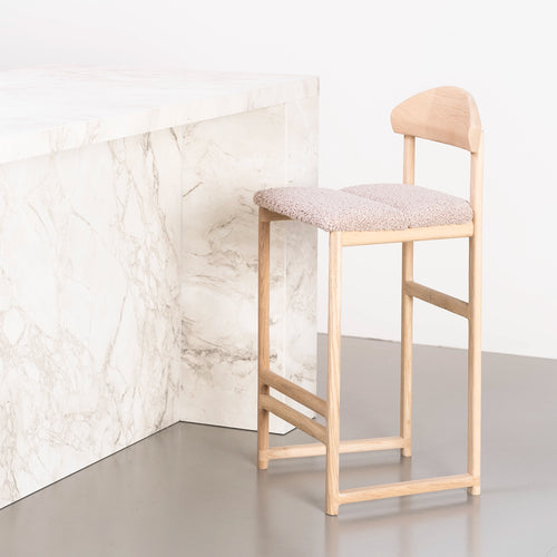 Ted bar stool in solid oak with greige bouclé seat, showcasing Scandinavian design and plush texture.