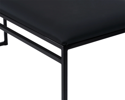 Wilma Steel Bench corner detail with black powder-coated frame and fitted black vegan leather cushion | by Crea.