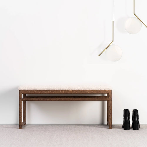 Wilma wood bench in dark oak with ivory bouclé, ideal for bedroom or hallway decor.
