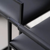 Arm and Backrest in Jade black vegan leather, fitted to a black steel by Crea chair