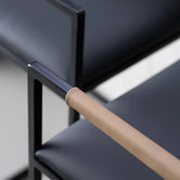 Arm and Backrest in Latte vegan leather, fitted to a black steel by Crea chair