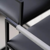 Arm and Backrest in Light grey vegan leather, fitted to a black steel by Crea chair