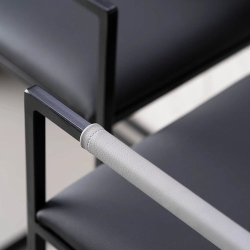 Arm and Backrest in Light grey vegan leather, fitted to a black steel by Crea chair