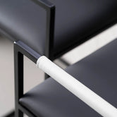 Arm and Backrest in White vegan leather, fitted to a black steel by Crea chair