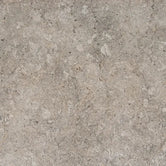 Close-up of Dekton Grigio sintered stone, a mid grey surface with soft tonal movement