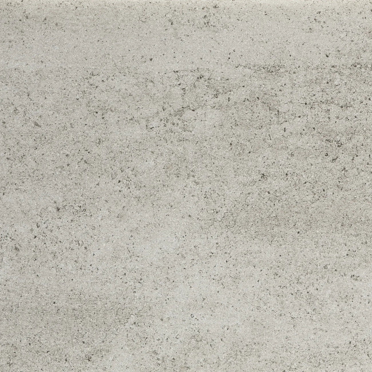 Close-up of Dekton Keon stone showcasing a cool, light grey surface with subtle speckling and a concrete-inspired texture, perfect for contemporary Scandinavian interiors and tabletops.