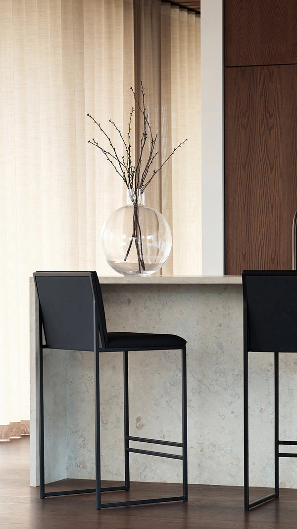 Bar Stool Philip in black at a kitchen counter