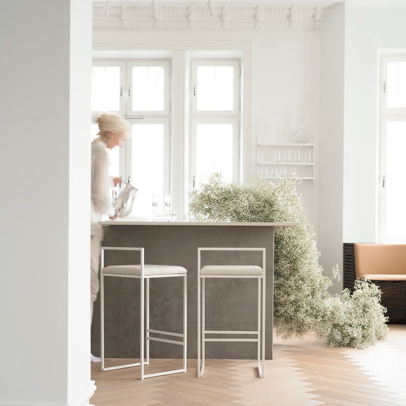Bar Stool Freja in ivory vegan leather on a white frame, 66 cm counter height, alternate view