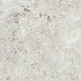 Close-up of Dekton Sabbia sintered stone, a warm sand-toned surface with fine speckling