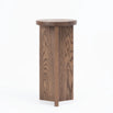 Affe pedestal in dark oak wood with a minimalistic design, perfect for modern home decor.