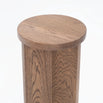 Affe pedestal in dark oak, featuring a minimalistic design and rich solid wood texture.