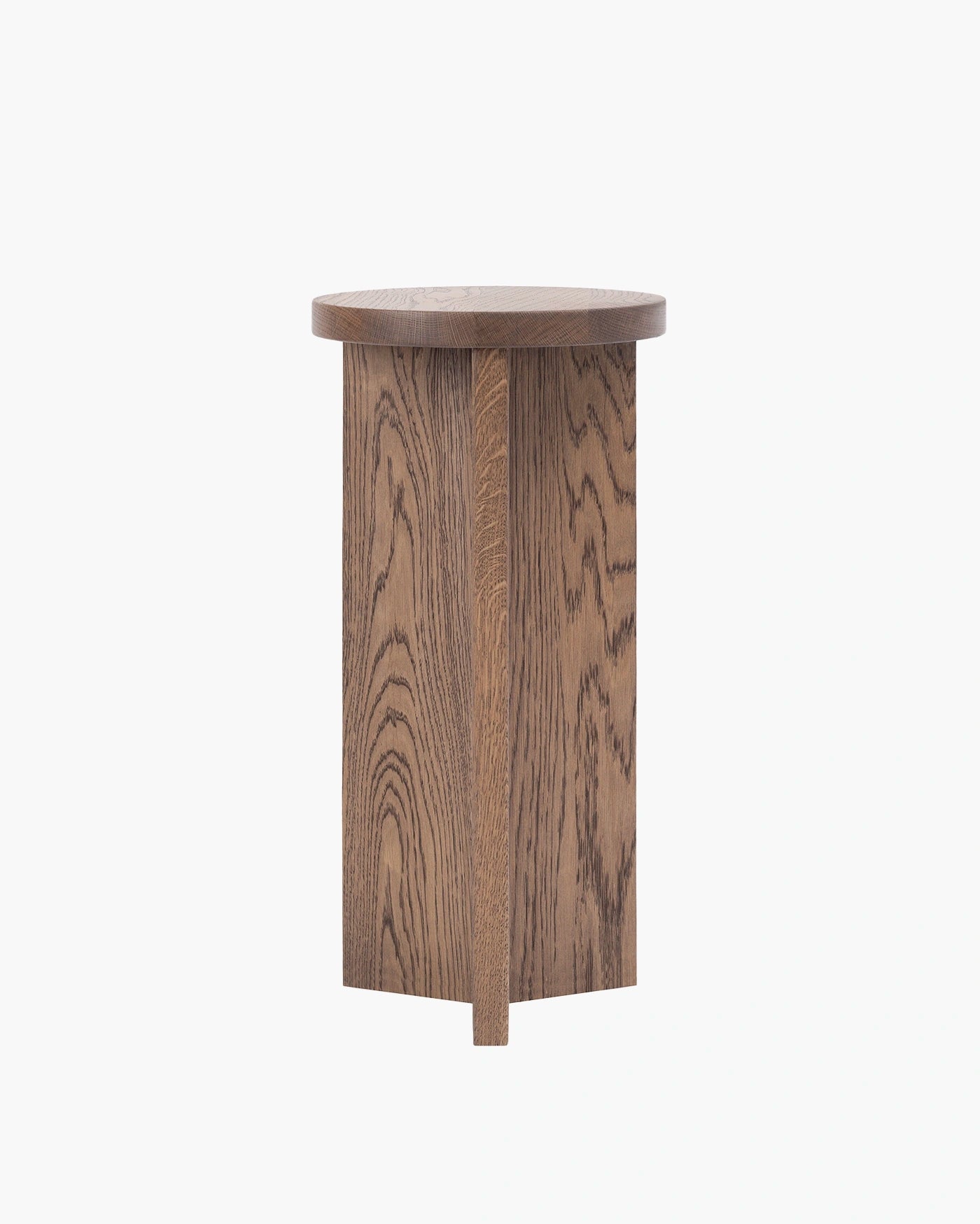 Affe pedestal in dark oak, minimalistic design emphasizing rich solid wood craftsmanship.