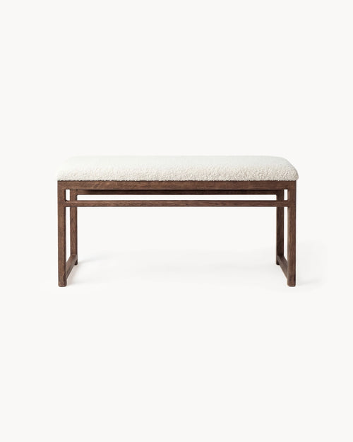 Oak Bench Alva with dark oak frame and ivory bouclé cushion, perfect for dining interiors and hallways.