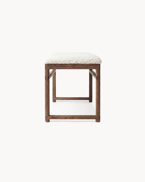 Oak Bench Alva featuring a dark oak frame and ivory bouclé cushion, ideal for dining and hallway settings.