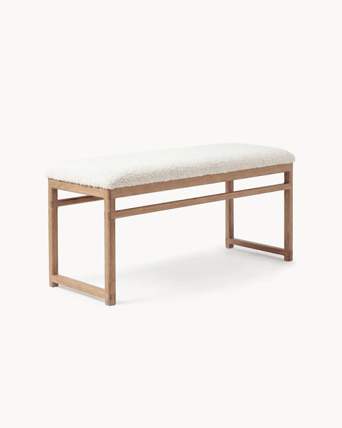 Oak Bench Alva with solid oak frame and ivory bouclé cushion for stylish seating.