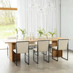 Ann dining table in oak with stylish chairs, enhancing a bright dining space with natural warmth and elegance.