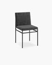 Bella dining chair in black velvet with minimalist design and sophisticated texture.