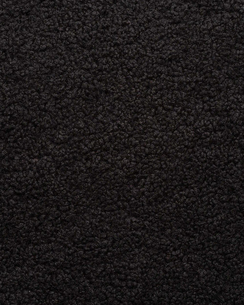 Close-up of black boucle, showing the looped texture of the woven pile