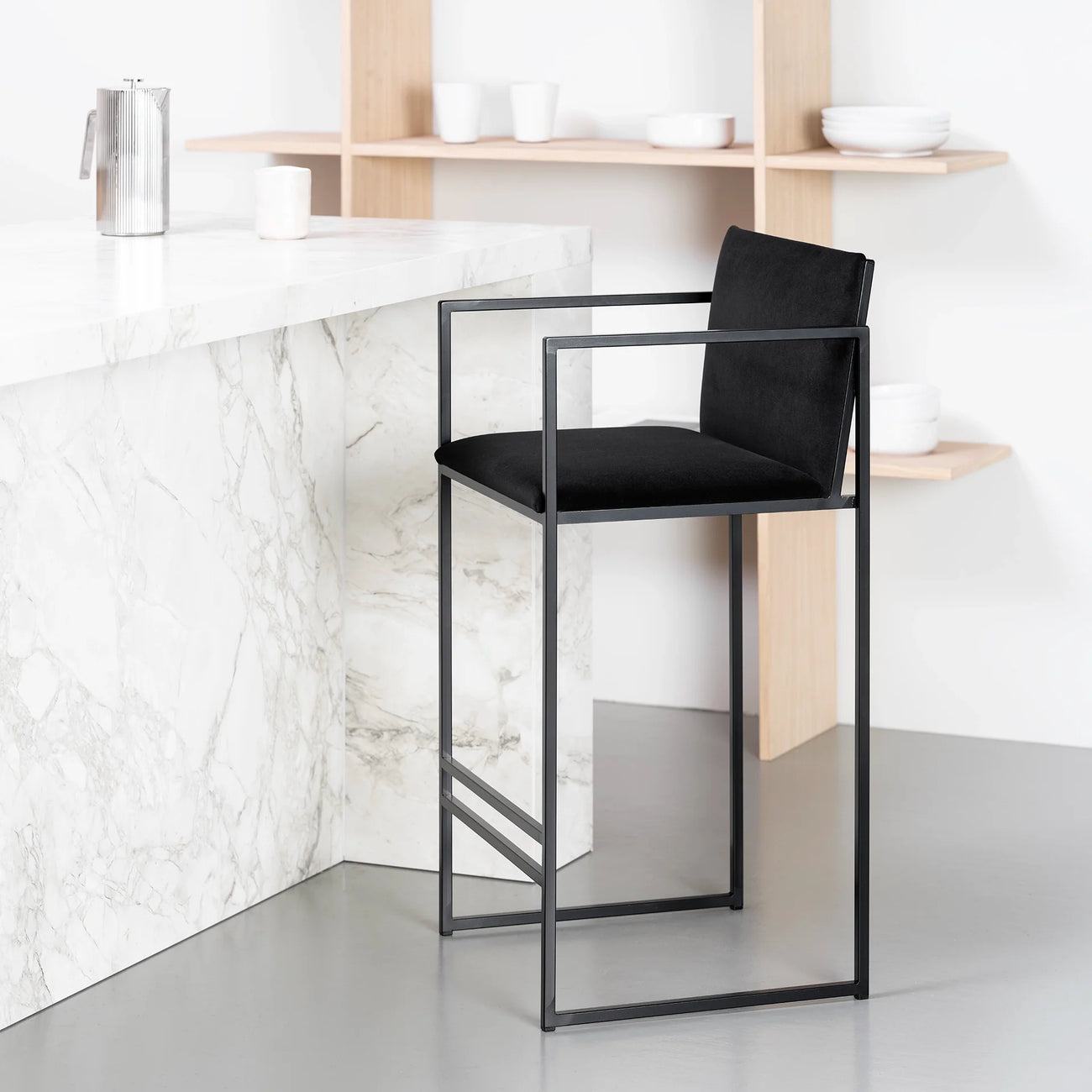 Bruno bar stool in black with jade black velvet, featuring a sculpted Scandinavian design for modern kitchens.