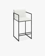 Bruno Bar Stool with black steel frame and ivory vegan leather upholstery, Scandinavian modern bar stool with backrest and armrests, handcrafted for kitchen islands and dining counters
