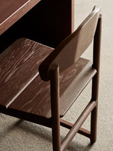 Close-up of the Karin chair by by Crea, finished in a custom wood colour created for Norrbottens Destilleri.