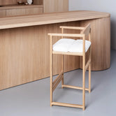 Oak Bar Stool Carl in oak with ivory bouclé, modern minimalist design for daily use.