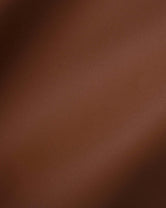 Close-up of Chocolate vegan leather, showing its fine grain