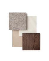 Material board featuring a dark oak wood sample, speckled dekton stone slab, and neutral beige and cream fabric swatches arranged in a minimalist Scandinavian palette.